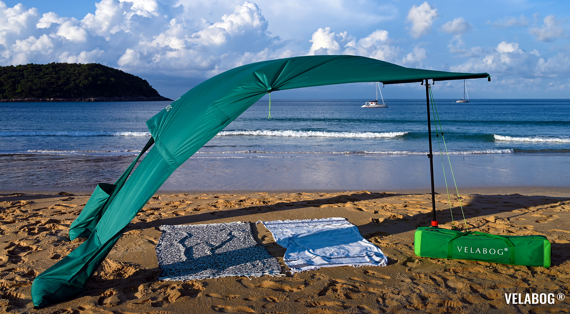 Beach sun sail Velabog Breeze, green. Best beach sun canopy tent, better and more stylish than beach umbrellas and pop up tents. Setup option for light to strong wind. View from the side.
