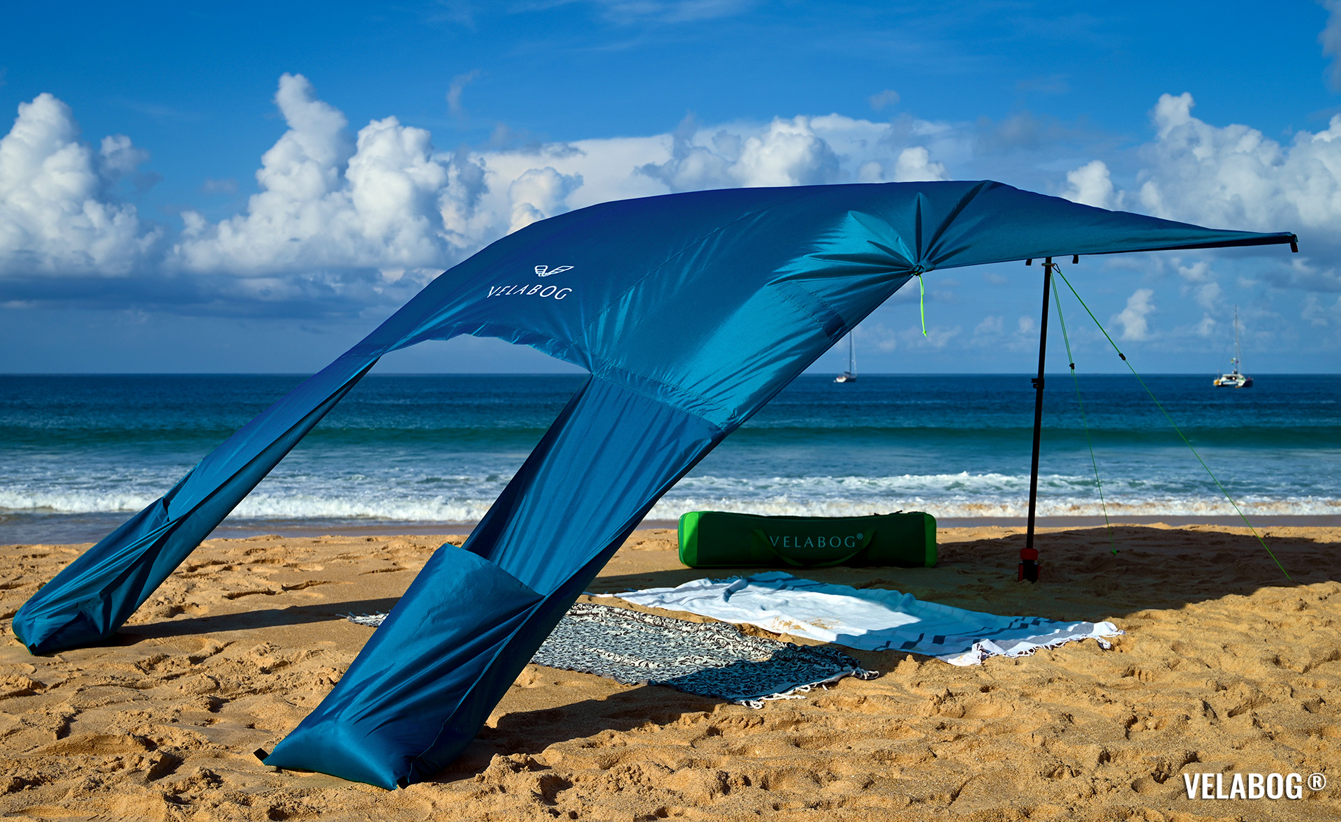 Beach sun sail Velabog Breeze, blue. Best and most stylish sun shelter on the beach. Best beach sun canopy tent. Setup option for light to strong wind.