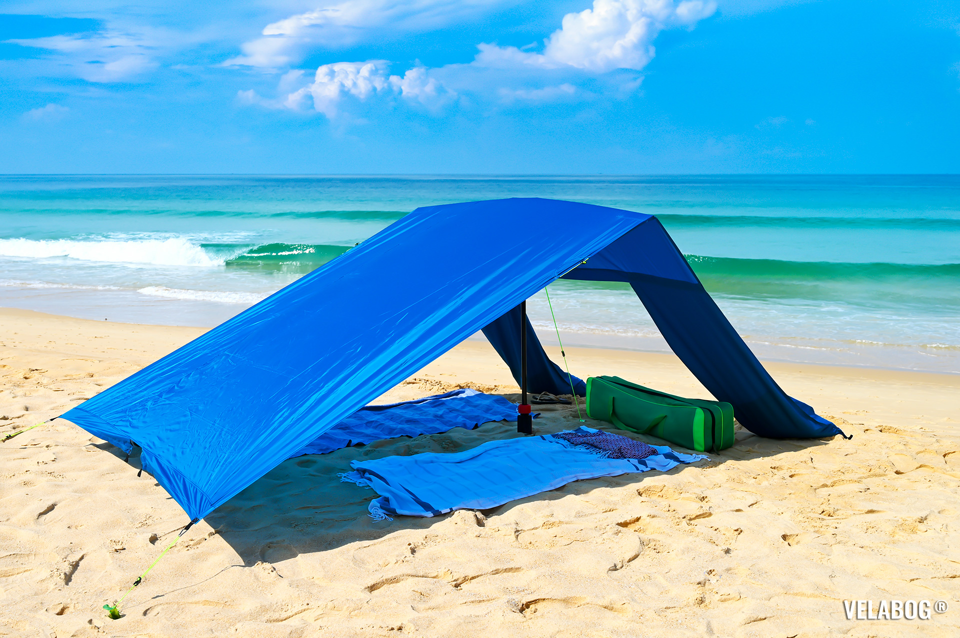 Beach sun sail Velabog Breeze, blue. Best beach sun canopy tent. Best sun shelter also on the windless beach. Setup option for no, light or gusty wind. Side view.