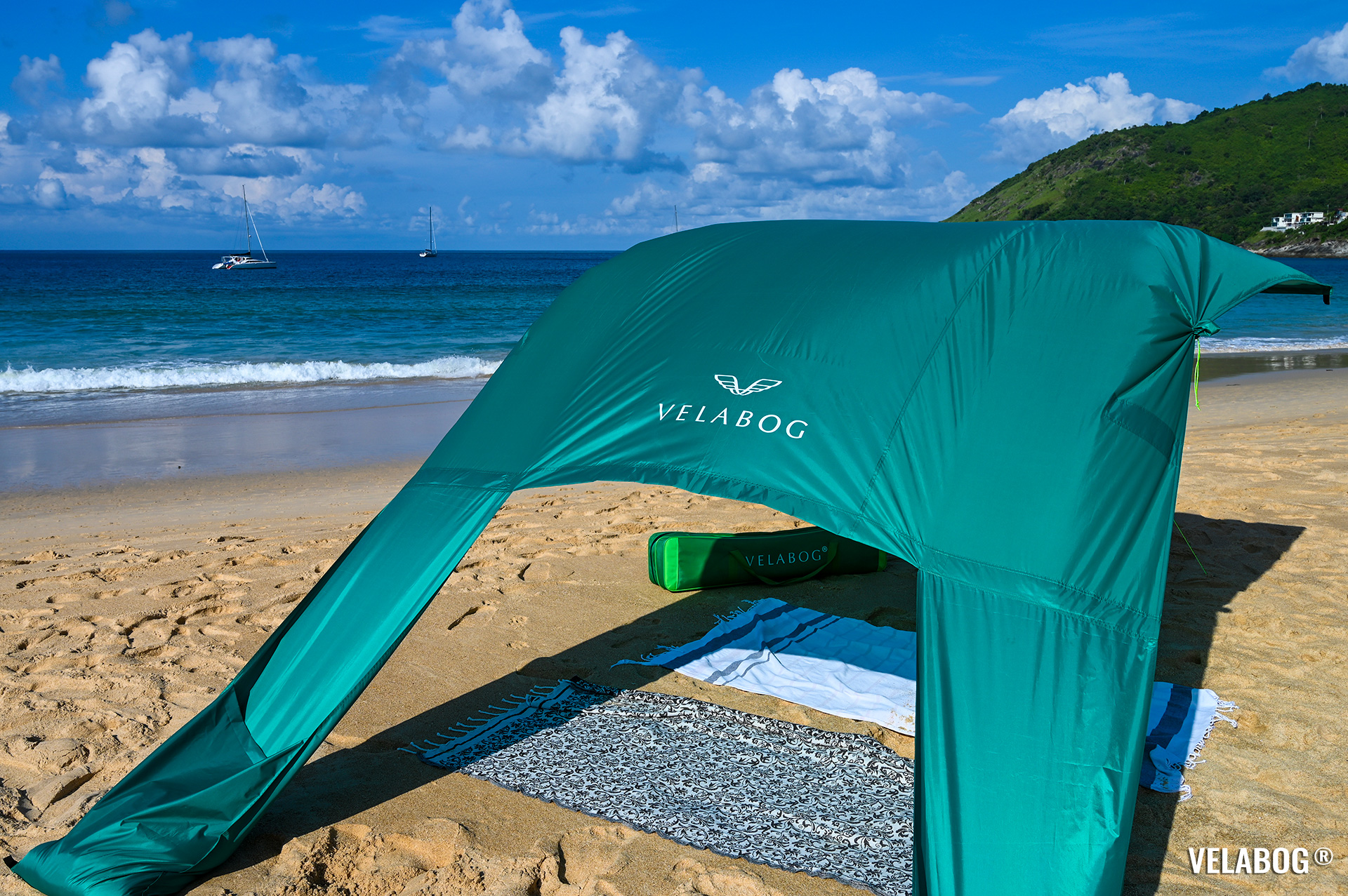 Beach sun sail Velabog Breeze, green. Best beach canopy tent, high quality sun shelter on the beach. Setup option for light to strong wind. View from behind.