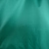 Dettaglio della superficie del tessuto della vela da sole tenda da spiaggia Velabog Breeze. 100% poliestere Ripstop. Colore verde.